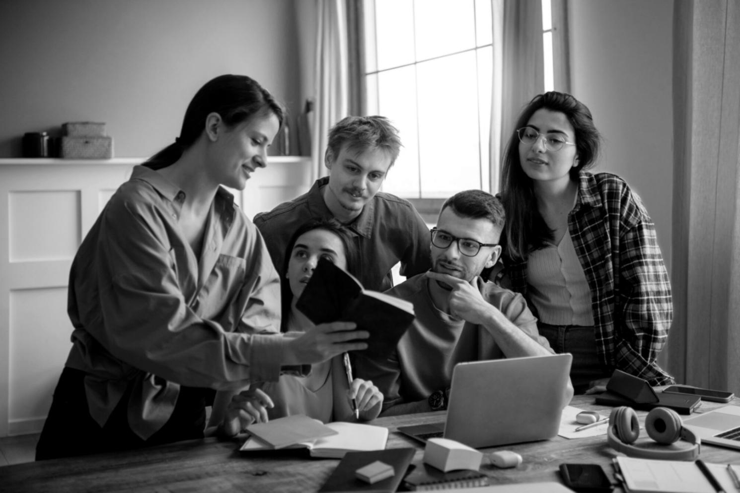 Modern training facility with financial professionals collaborating on investment reporting strategies